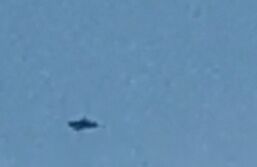 Zilveren driehoekige UFO boven Leerdam foto